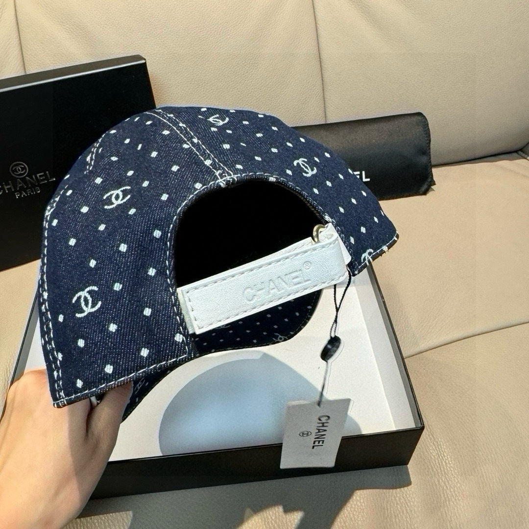 Chanel denim baseball cap with white dot print and CC logos, adjustable strap detail