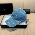Denim blue baseball cap with white dot pattern and white Chanel-style logo embroidery