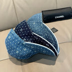 CHANEL blue denim cap with white dot CC pattern and underside strap loop