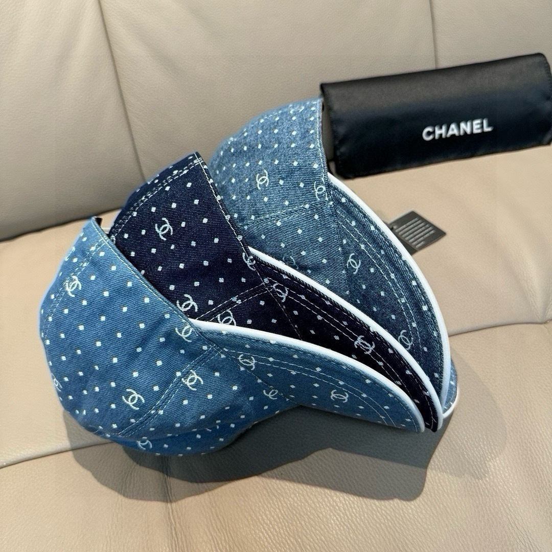 CHANEL blue denim cap with white dot CC pattern and underside strap loop