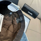 CHANEL cap interior with black lining and adjustable woven strap with tags