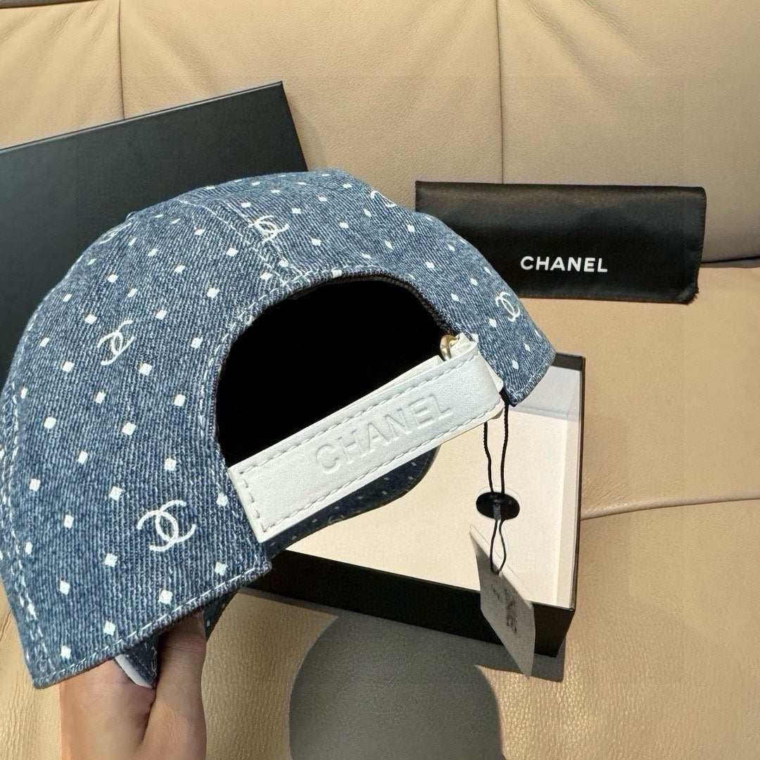 CHANEL blue denim cap with white leather strap and white dot CC logo pattern