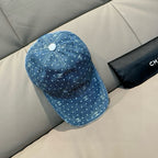 CHANEL blue denim cap with white dot CC logo pattern and small top button
