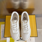 Cream low-top lace-up sneakers with FENDI logo on tongue, side, and heel