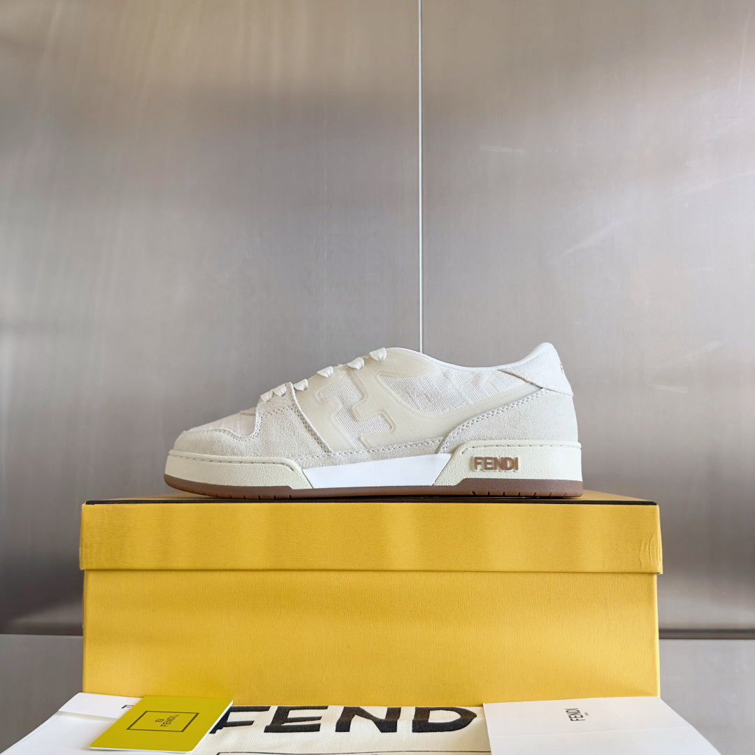 Cream low-top lace-up sneaker on yellow box with FENDI logo tab