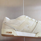 Cream low-top lace-up sneaker detail with FENDI logo patch on side