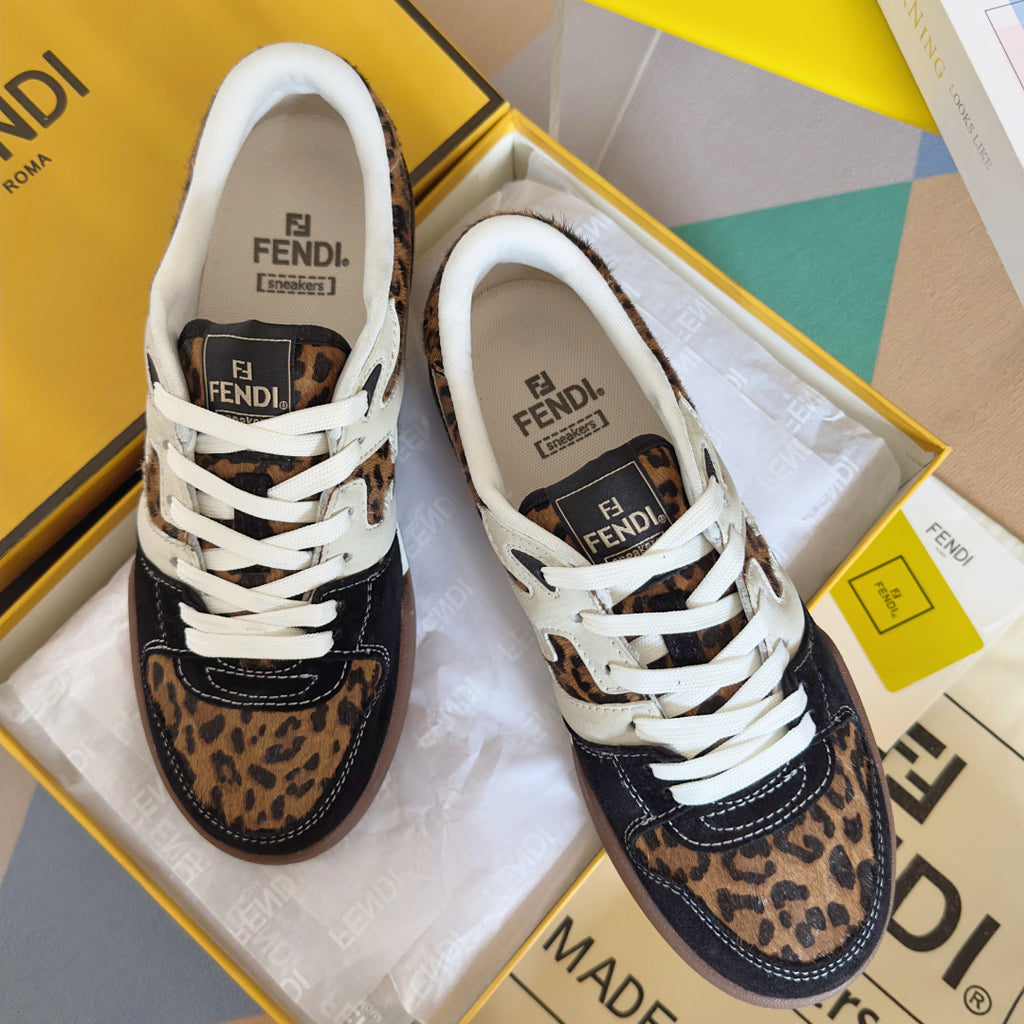 Unisex Fendi sneakers with white laces, leopard-print panels, and dark navy accents