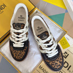Unisex Fendi sneakers with white laces, leopard-print panels, and dark navy accents