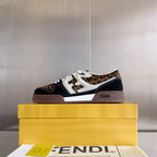 Low-top Fendi sneakers on a yellow box: leopard print panels with dark navy and white trim