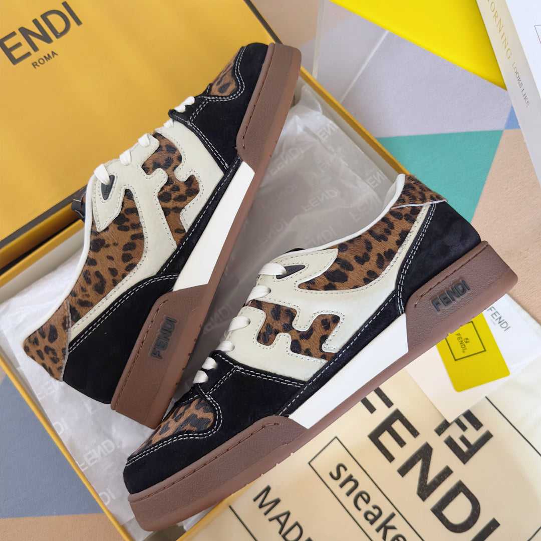 Unisex Fendi sneakers angled view: leopard print, navy uppers, white laces, tan sole