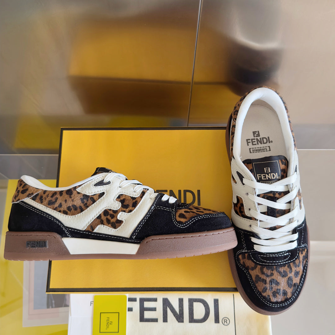 Fendi unisex low-top sneakers with leopard print uppers, white laces, and navy sides