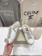Golden Goose sneaker pair, white leather with gray glitter trim and teddy-fleece tongue