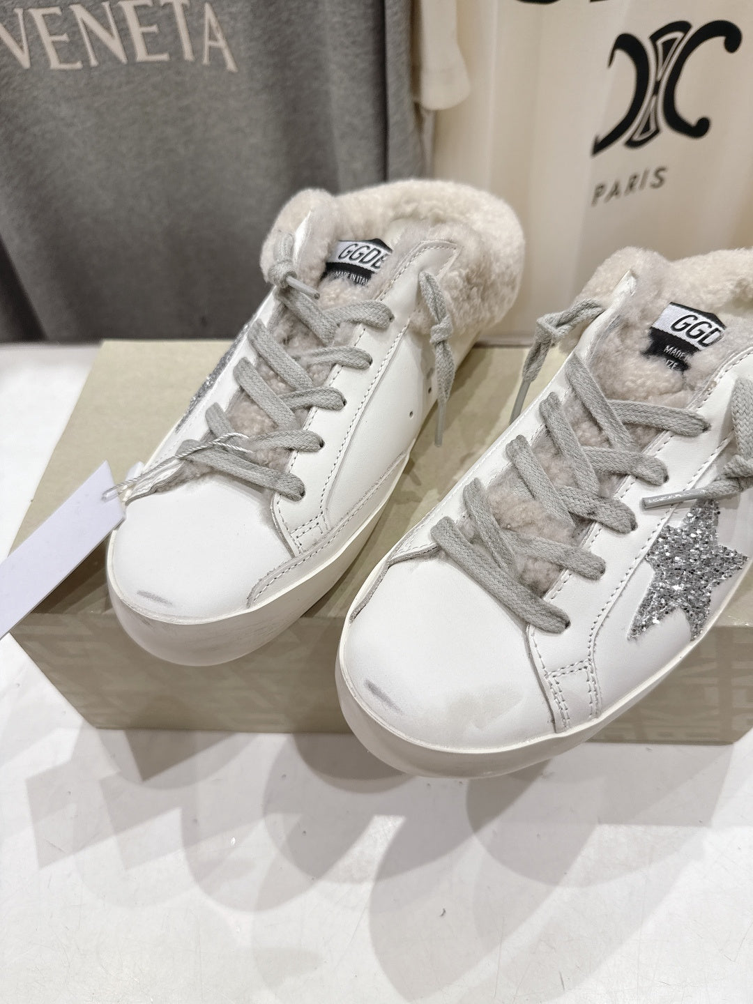 Golden Goose white low-top sneakers with gray glitter side detail and furry lining