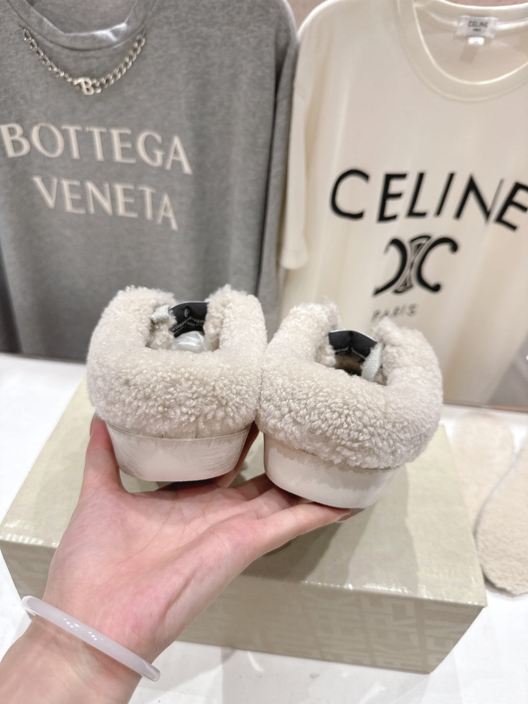 Golden Goose sneakers from side, plush shearling collar with gray glitter and black tags