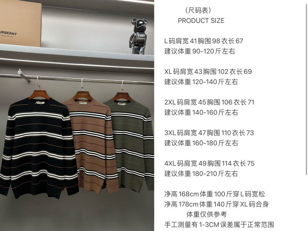 Three striped knit sweaters on rack in black, brown, and green