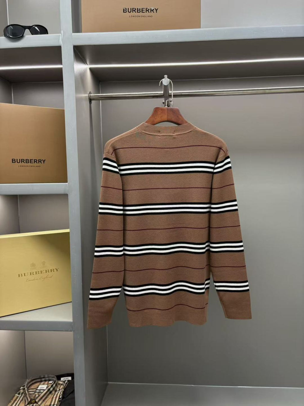 Brown striped knit sweater with crew neck and long sleeves
