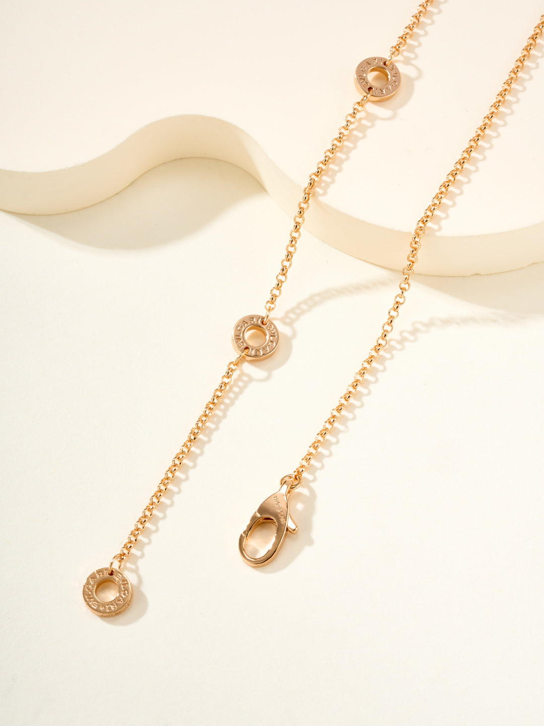 Gold necklace with round disc charms and linked chain