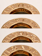 Bvlgari gold-tone engraved ring pieces with decorative lettering and inner markings