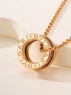Bvlgari gold-tone circular pendant necklace with engraved lettering
