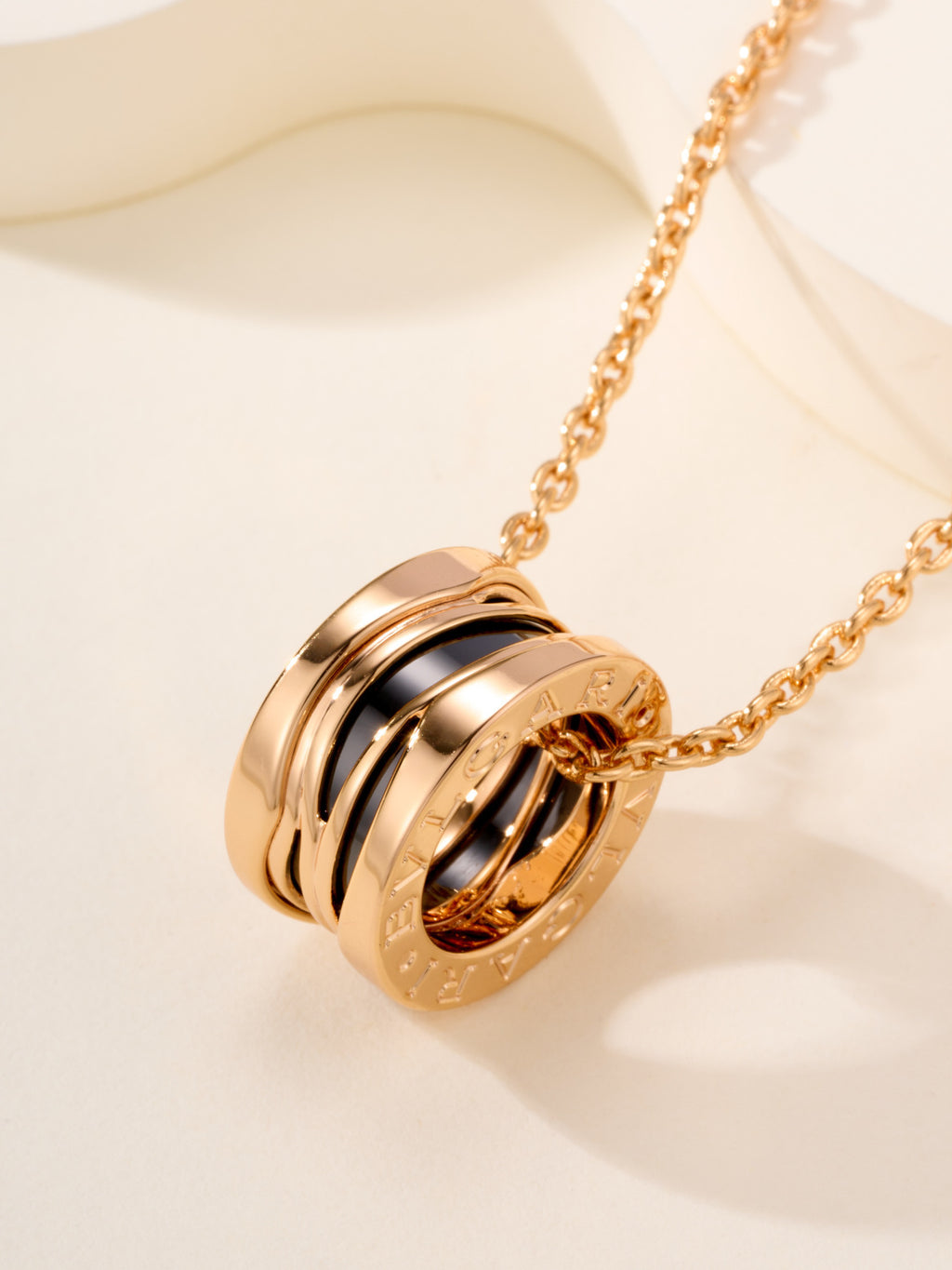 Bvlgari gold-tone pendant necklace with stacked ring charm in view