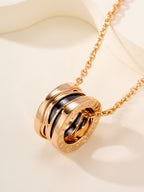 Bvlgari gold-tone pendant necklace with stacked ring charm in view