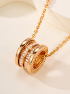 Bvlgari gold necklace with engraved cylindrical disc pendant