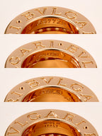 Bvlgari gold pendant disc with engraved Roman letters and 'ITALY'