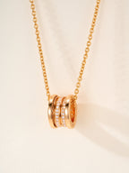 Bvlgari gold necklace with circular disc pendant and crystal insets