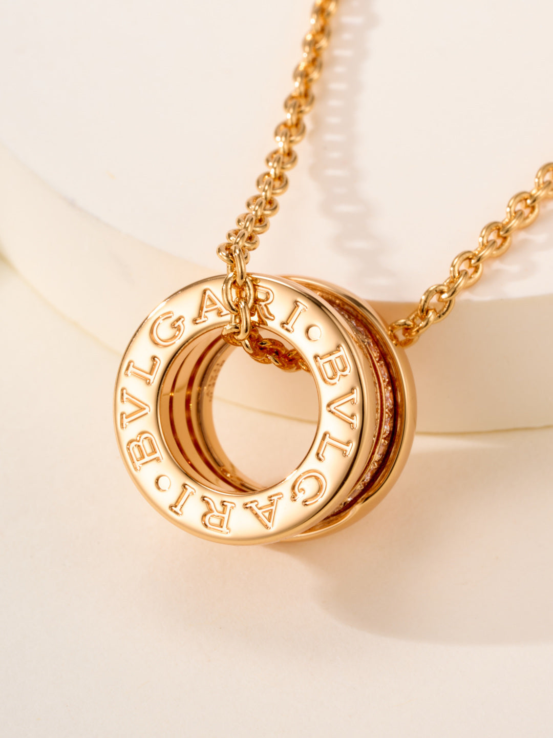 Bvlgari gold necklace with engraved 'BVLGARI' ring pendant