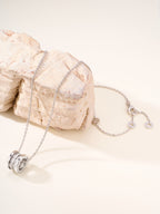 Bvlgari silver necklace with circular disc pendant on chain