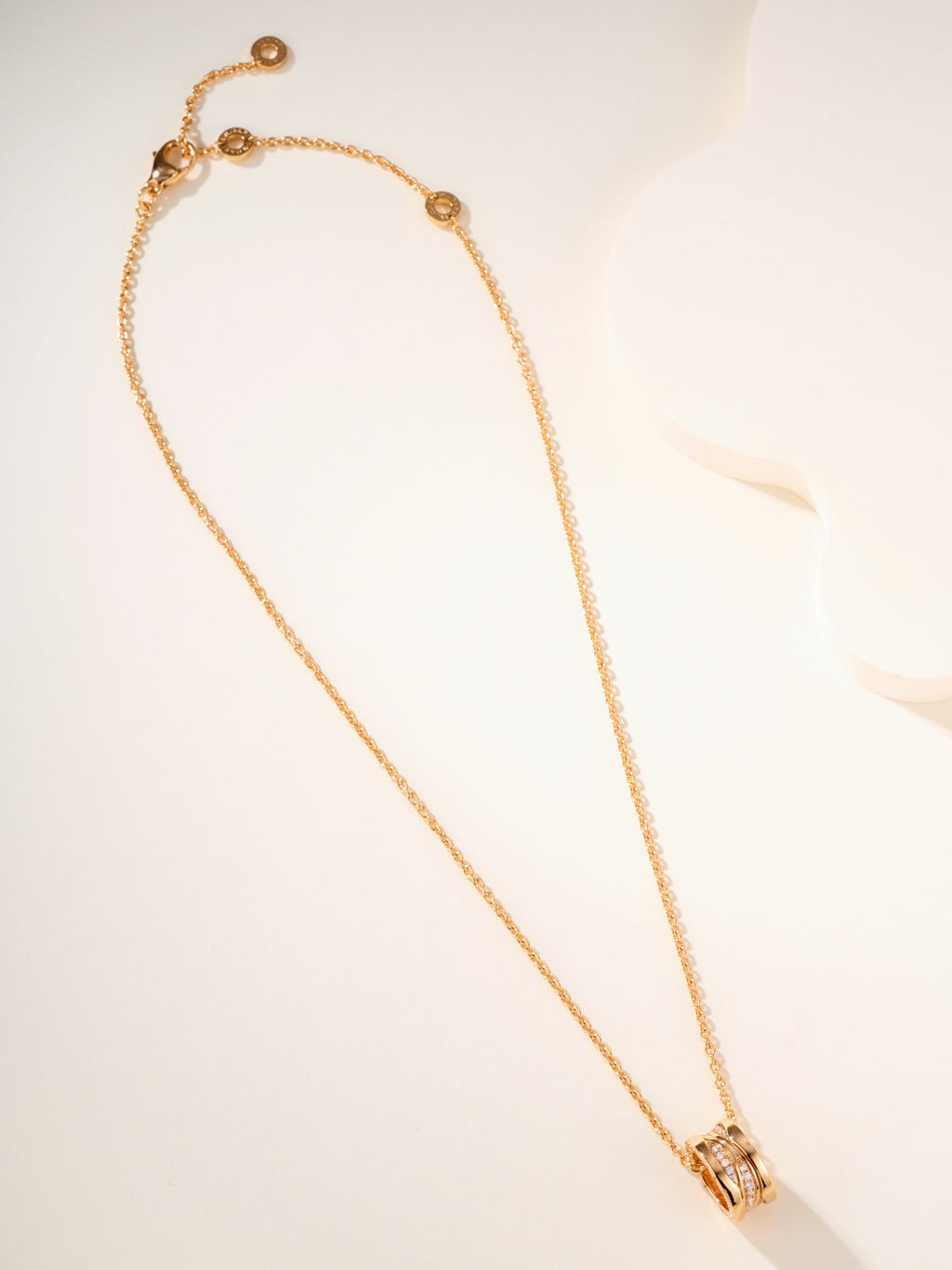 Gold-tone long chain necklace with hook clasp and small circular charm ends