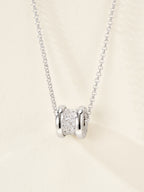 Silver necklace with pavé cylinder charm and linked chain