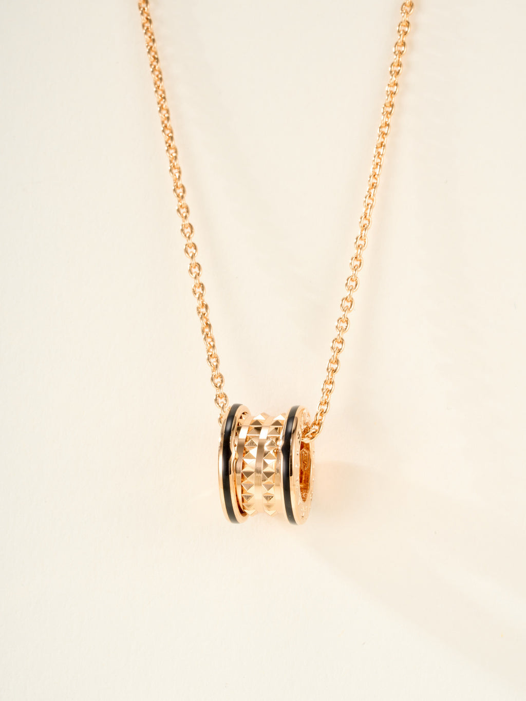 Bvlgari gold-tone necklace with cylindrical pendant and enamel accent rings