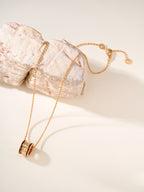 Bvlgari gold-tone necklace with cylindrical pendant and round enamel inset