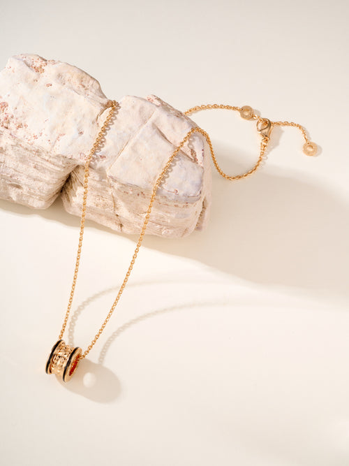 Bvlgari gold-tone necklace with cylindrical pendant and round enamel inset