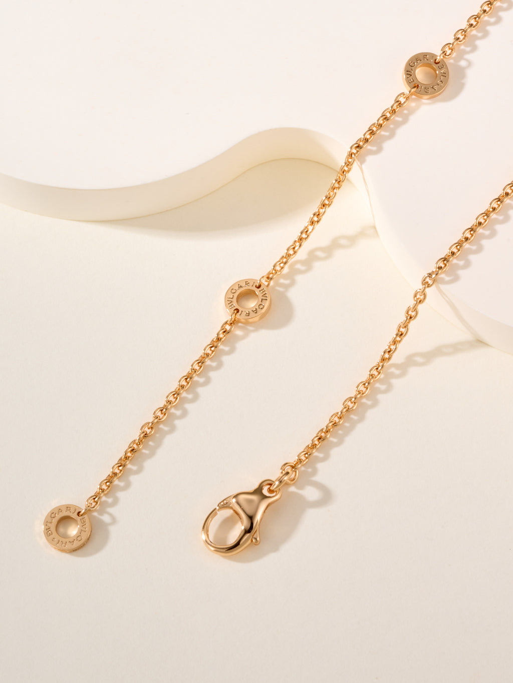 Bvlgari gold necklace with three round disc charms and chain