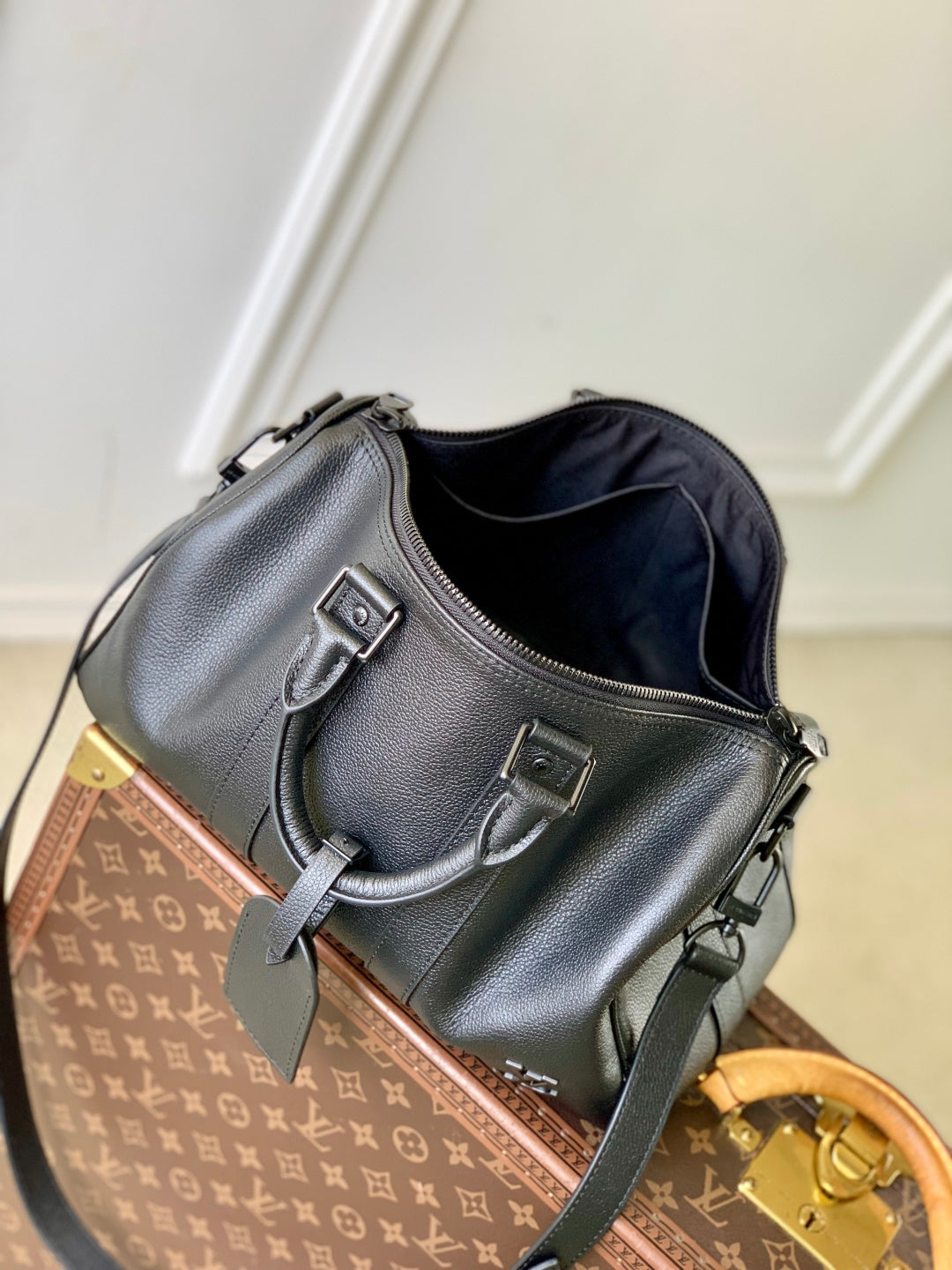 Louis Vuitton men’s dark blue leather bag with front buckle straps and zip opening