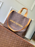 Louis Vuitton monogram tote bag with tan leather handles and bold front logo