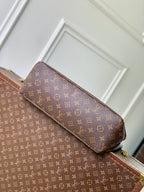 Louis Vuitton monogram bag with tan shoulder strap and top flap
