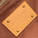 Louis Vuitton leather patch with stitched edges and gold-tone stud hardware
