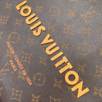 Louis Vuitton monogram canvas close-up with gold-tone logo lettering