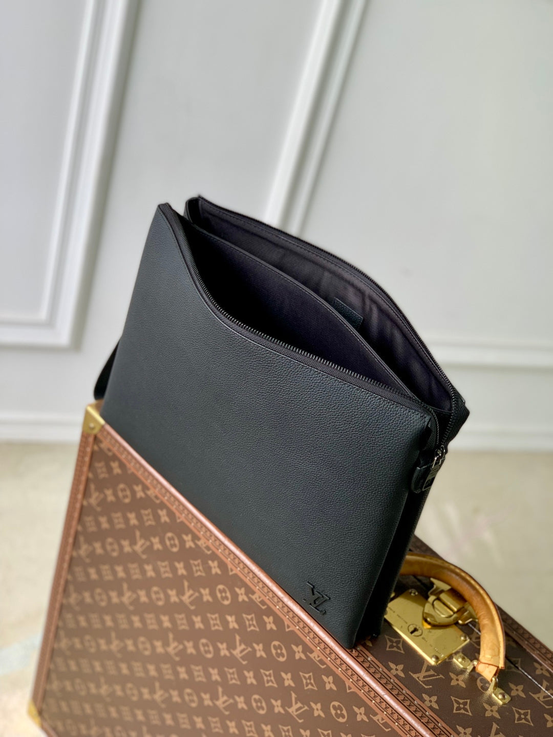 Men's Louis Vuitton leather bag, dark blue exterior with open top and black interior