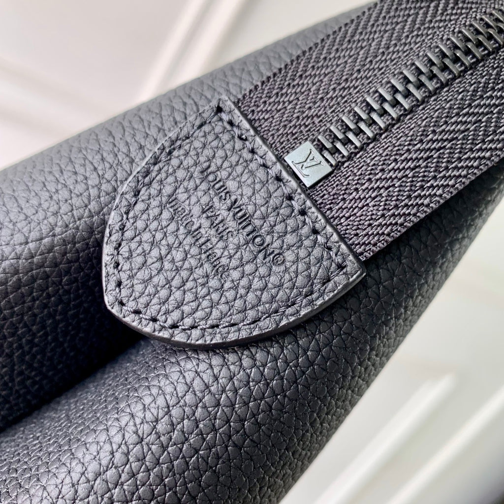 Men's Louis Vuitton bag zipper edge and LV logo patch on dark blue leather