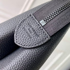 Men's Louis Vuitton bag zipper edge and LV logo patch on dark blue leather
