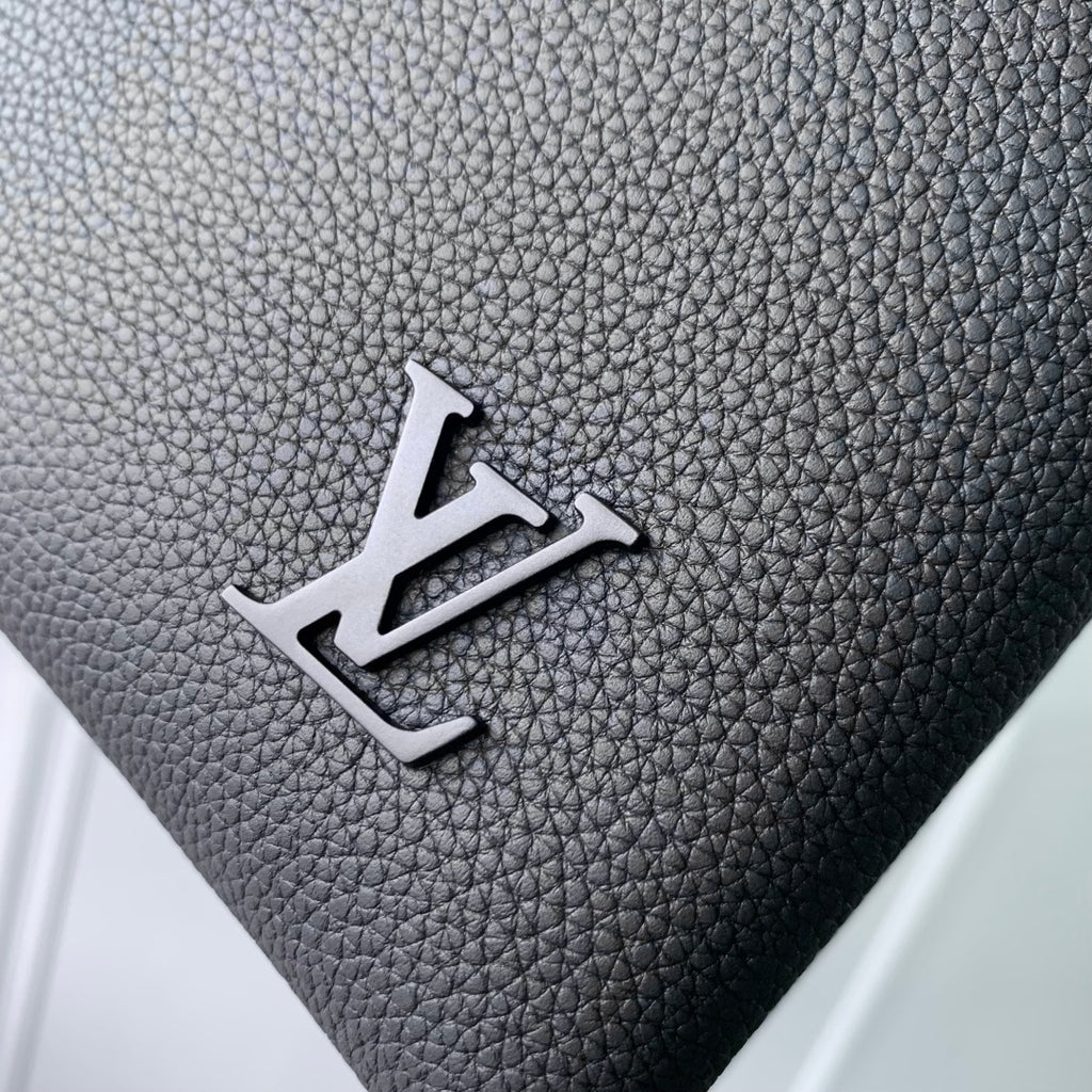 Men's Louis Vuitton bag front logo, silver LV emblem on dark blue textured leather