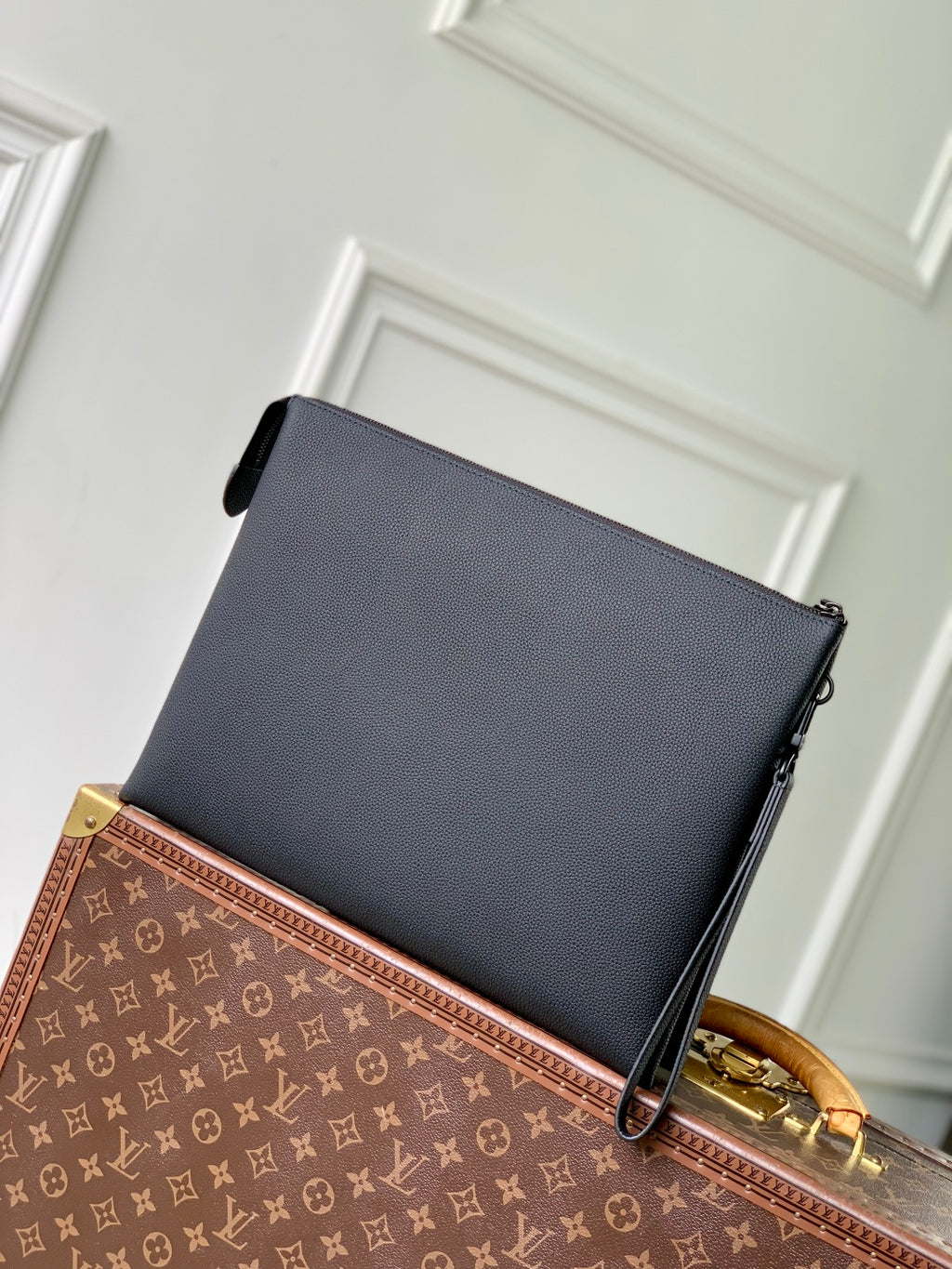 Men's Louis Vuitton leather bag, dark blue with LV logo and black zipper closure