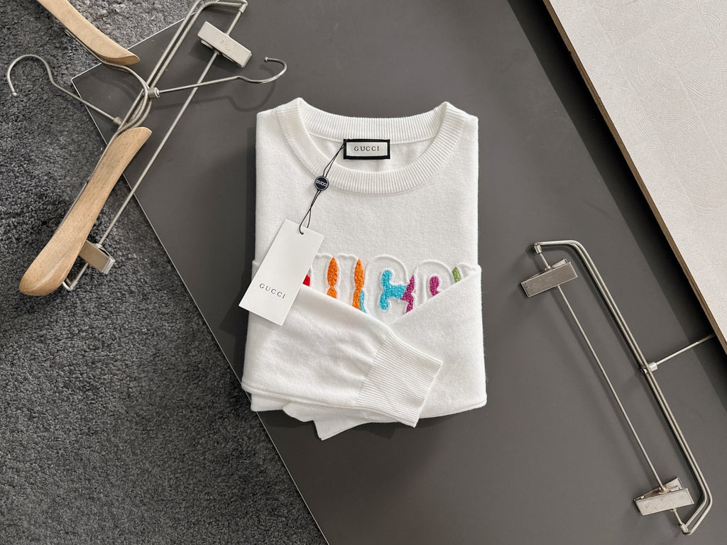 White crewneck sweatshirt with multicolor Gucci logo embroidery and ribbed hem