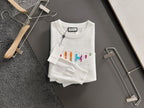 White crewneck sweatshirt with multicolor Gucci logo embroidery and ribbed hem