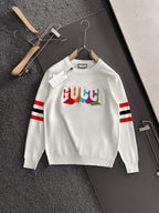 White crewneck sweatshirt with multicolor Gucci logo and red/black/white striped sleeves