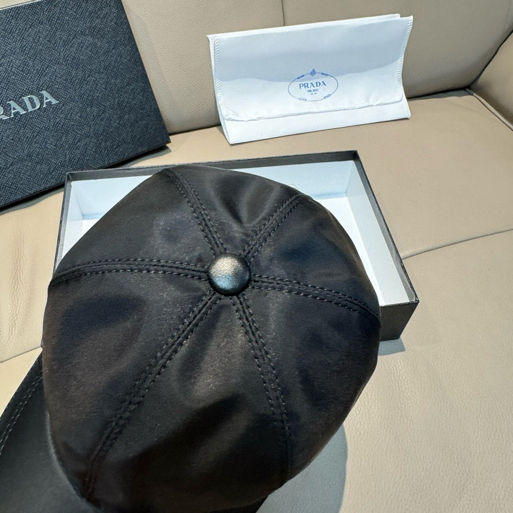 Black baseball cap crown with round top button and fan-style stitched seams.